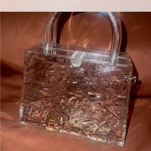 Elegant Transparent Handbag with Brown Accents